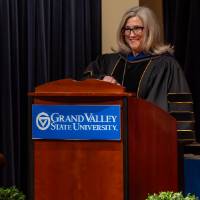 faculty on stage talking